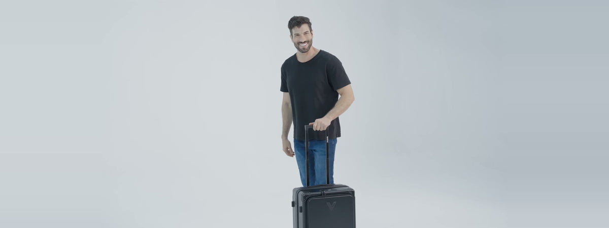 Man rolling the Backvac Flight Carry-on